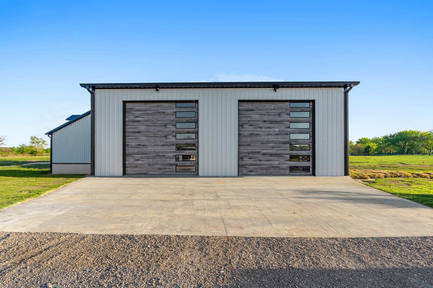 Barndominium with oversized garage bays