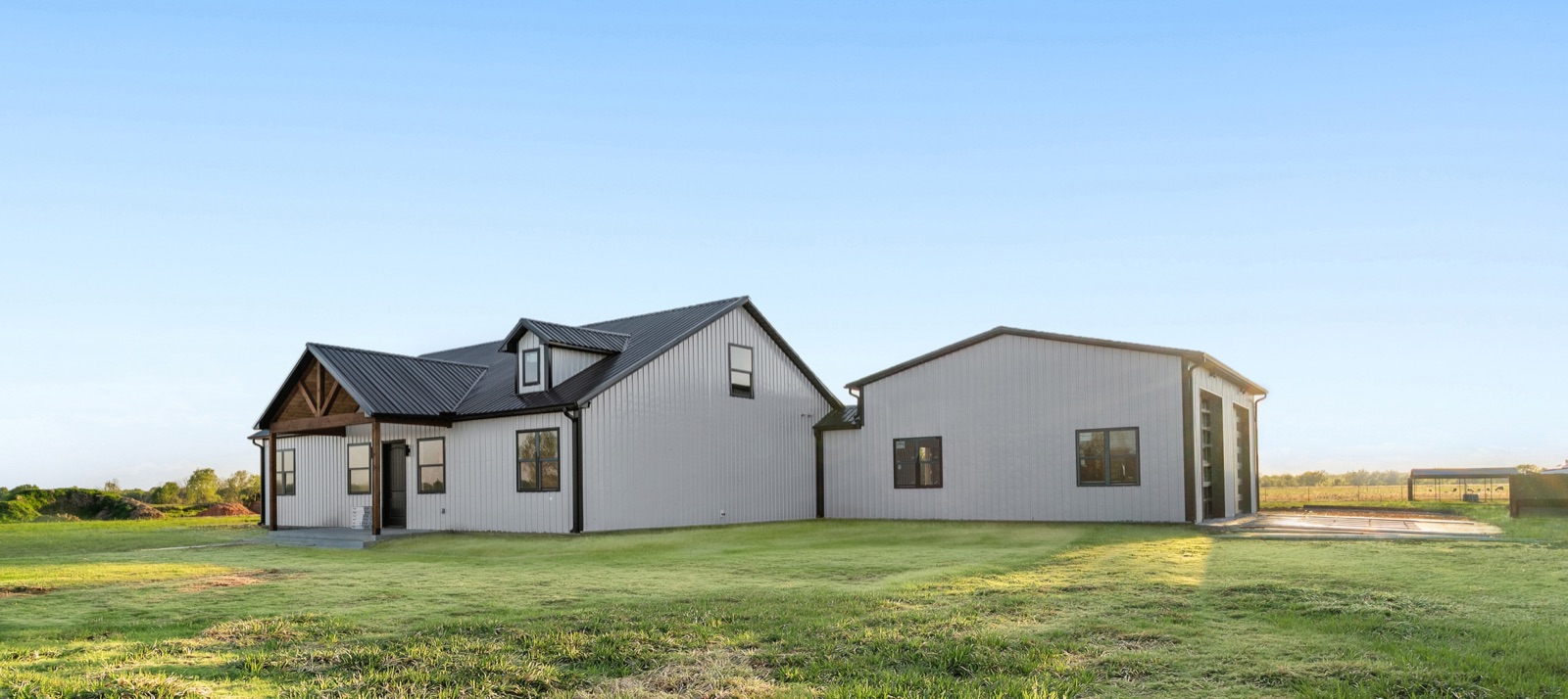 Finished modern farmhouse with metal shop